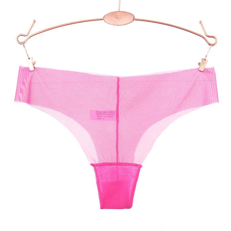 Panty string en maille transparente du bord brut